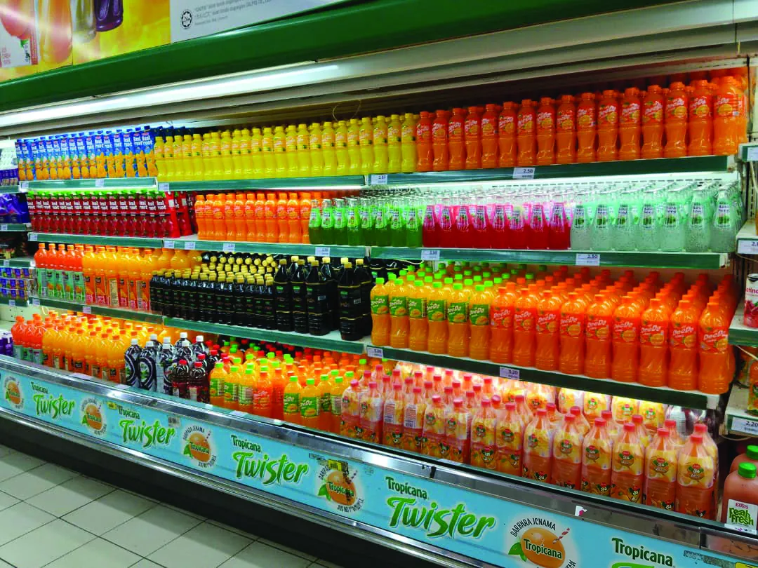 FMCG beverages displayed across a Malaysian retail shelf